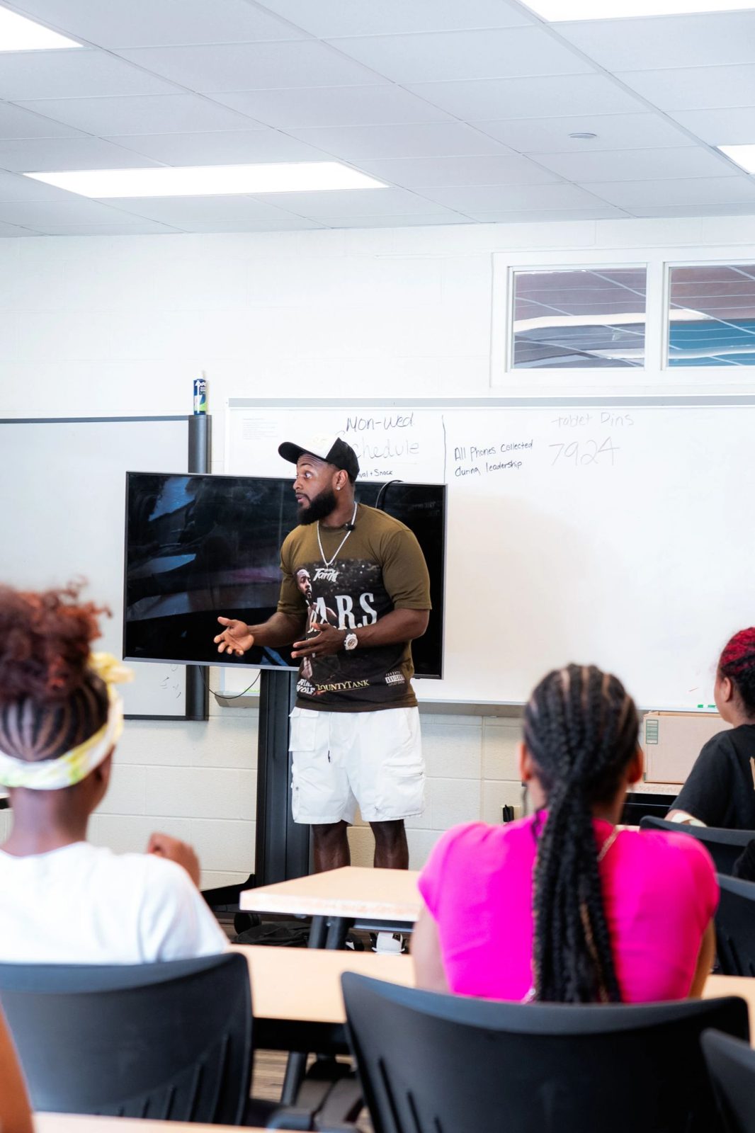 Tank speaking in front of a classroom at Akron Reach