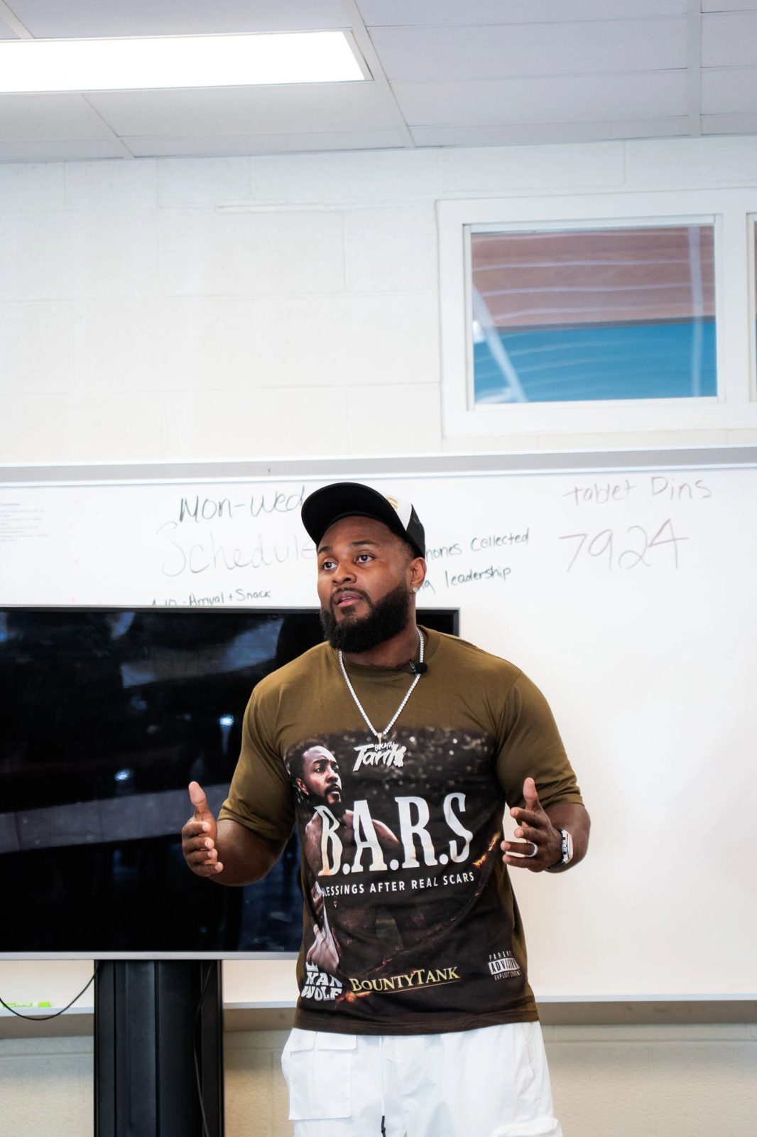 Tank speaking to students at Akron Reach