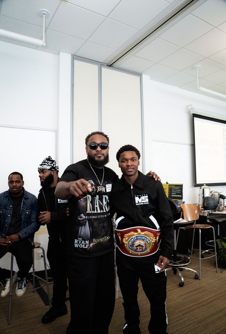 Tank in a B.A.R.S. shirt with a world champion boxer